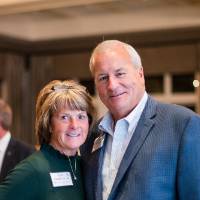 Kim Schmidt taking a photo with Steve Workman.